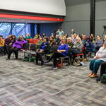 Audience and Gabi DalSanto presenting 