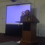 Professor Kristen Pullen with vintage puppets talking about Charlotte Charke